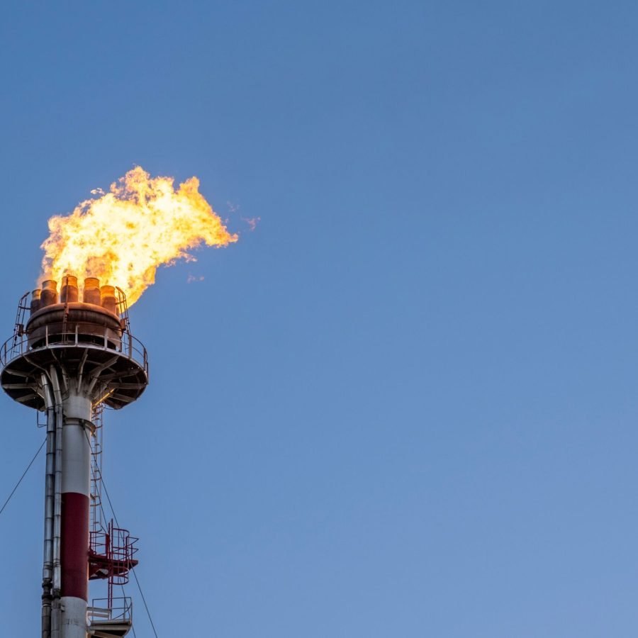 A firer on the top of the tower of the petrochemical industry in a refinery in Tarragona, Spain