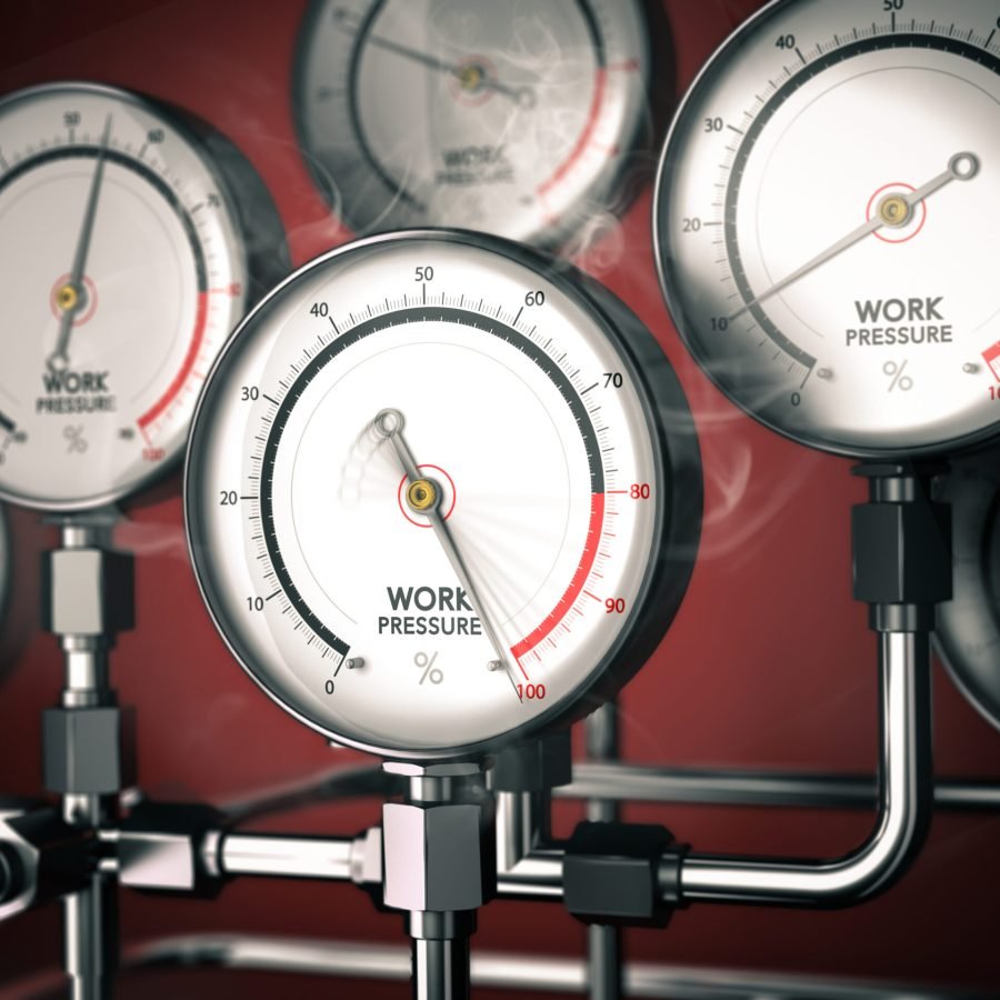 3D illustration of gauges with one overloaded over red background. Concept of overwork or workplace stress management.